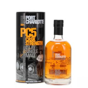port charlotte pc5 evolution cask strength clear bottle standing beside a black tin front image