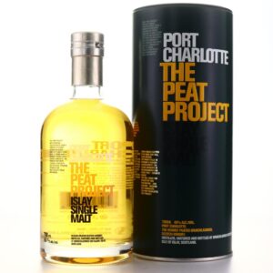 port charlotte the peat project bottle front standing beside a black metal tin