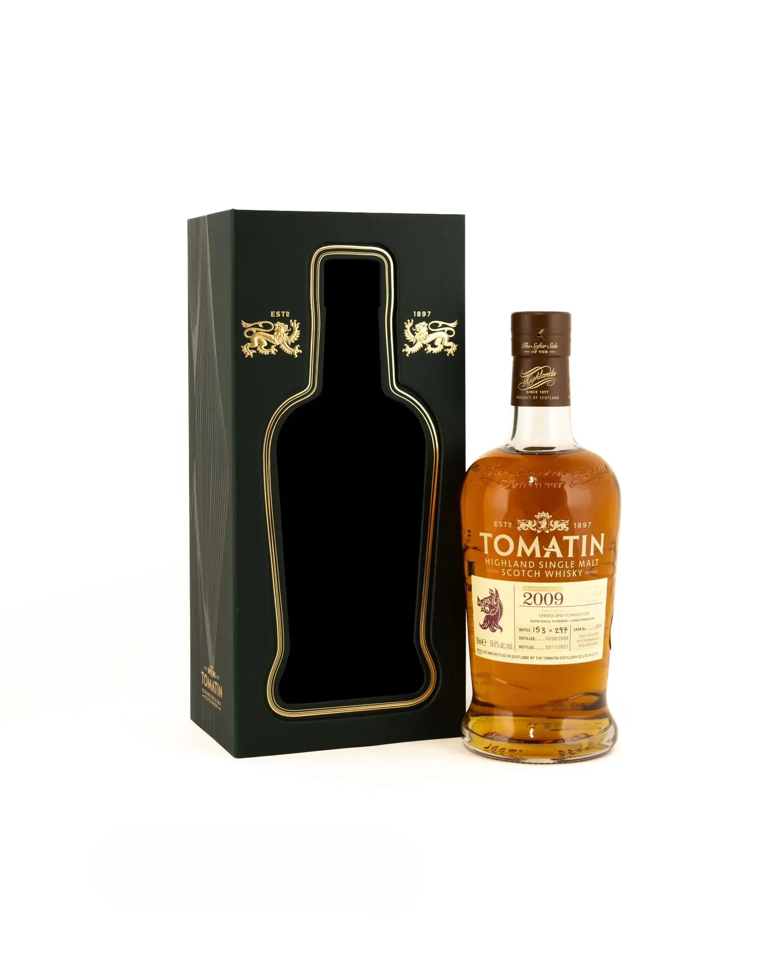 tomatin 2009 12 year old single cask bottle with cream label standing beside a green wooden presentation box