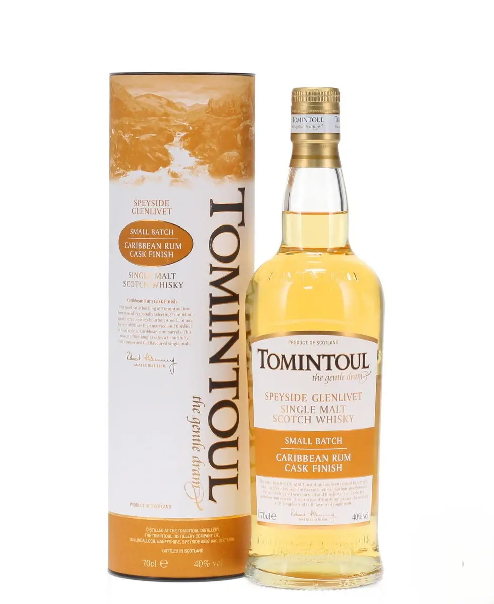 tomintoul caribbean rum cask finish clear bottle standing beside yellow and white tin front image